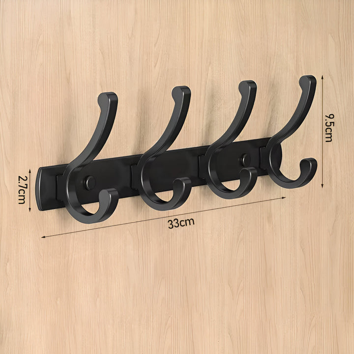 4 Crochets muraux en aluminium noir fixés sur une surface en bois, parfaits pour un intérieur moderne ou vintage